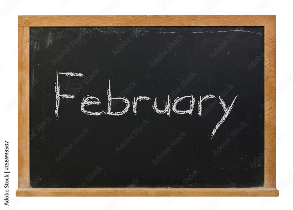 February written in white chalk on a black chalkboard isolated on white February written in white chalk on a black chalkboard isolated on white
