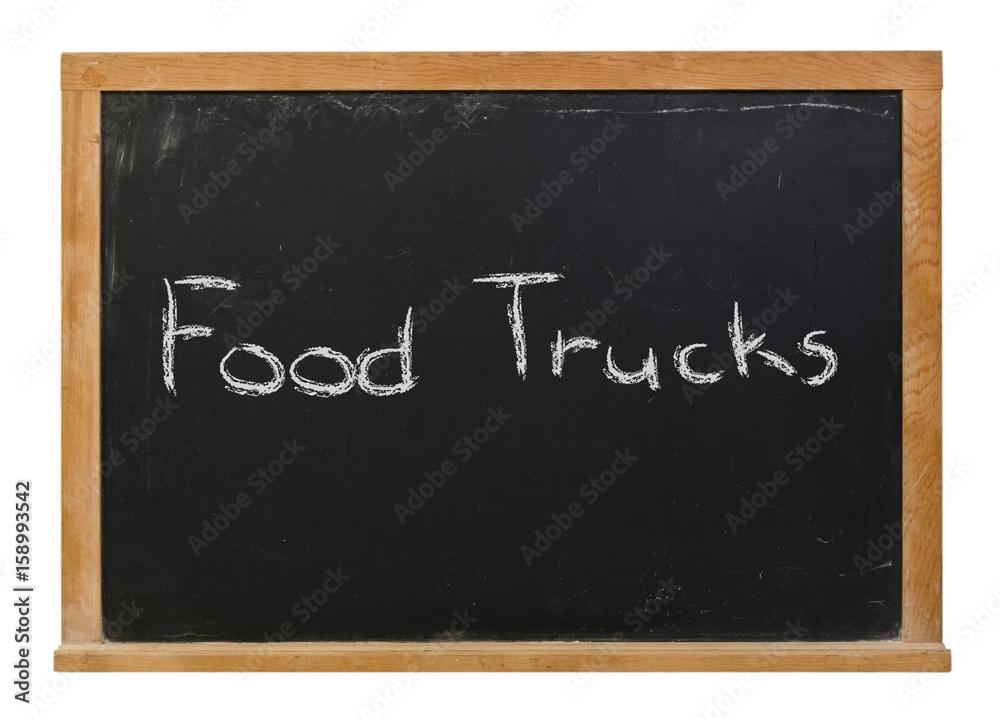 Obraz premium Food Trucks written in white chalk on a black chalkboard isolated on white