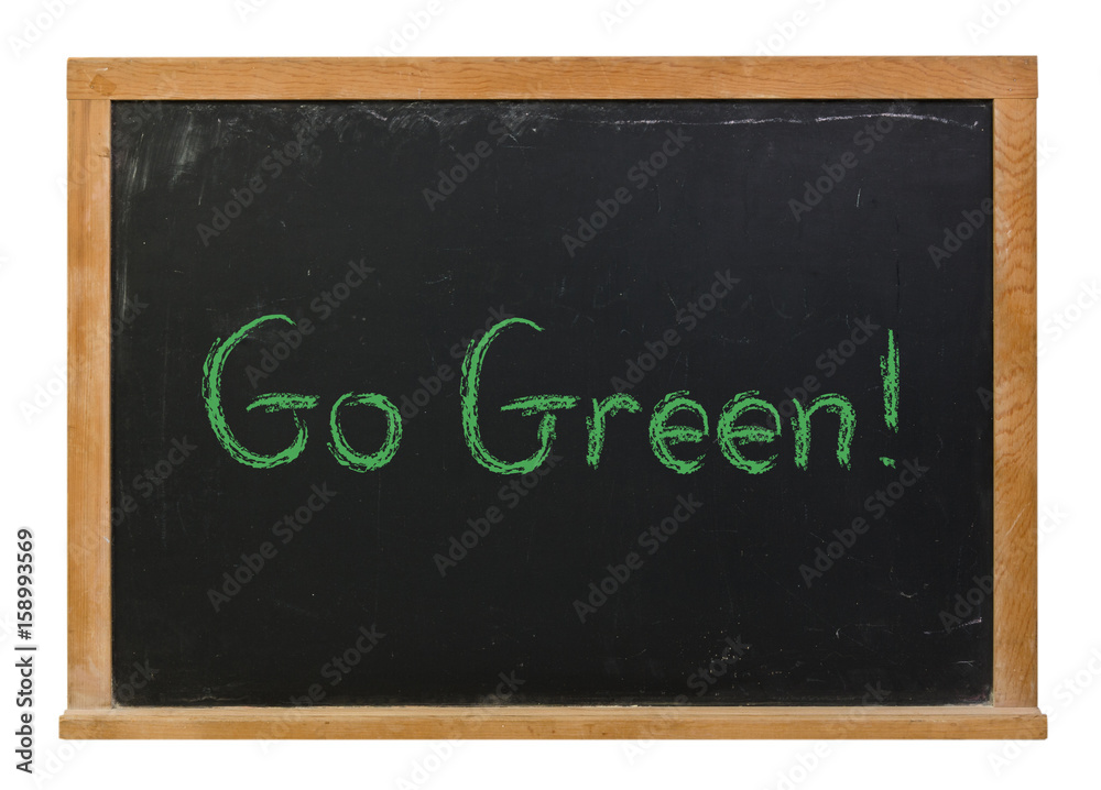Obraz premium Go Green written in green chalk on a black chalkboard isolated on white