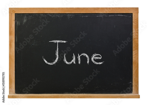 June written in white chalk on a black chalkboard isolated on white
