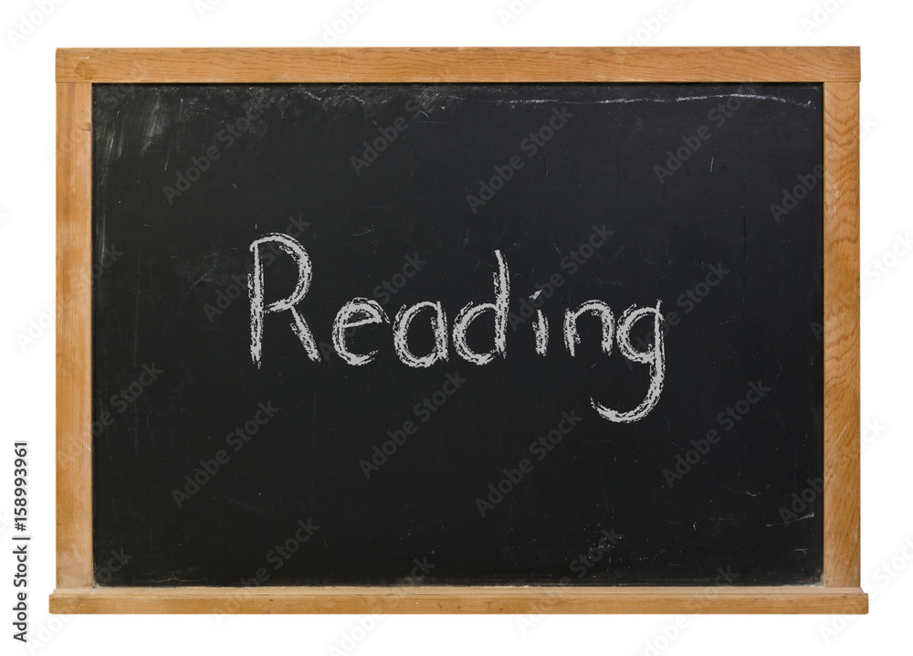Reading written in white chalk on a black chalkboard isolated on white
Reading written in white chalk on a black chalkboard isolated on white