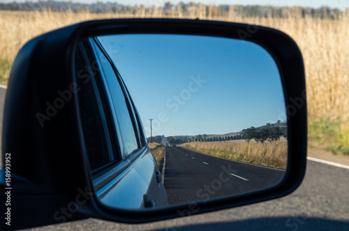 View of a road in the rear view mirror © nilsversemann