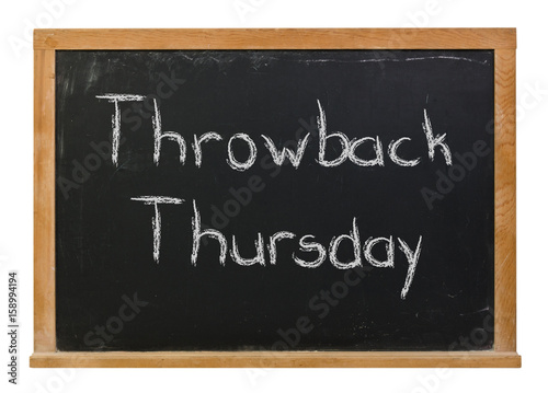 Throwback Thursday written in white chalk on a black chalkboard isolated on white