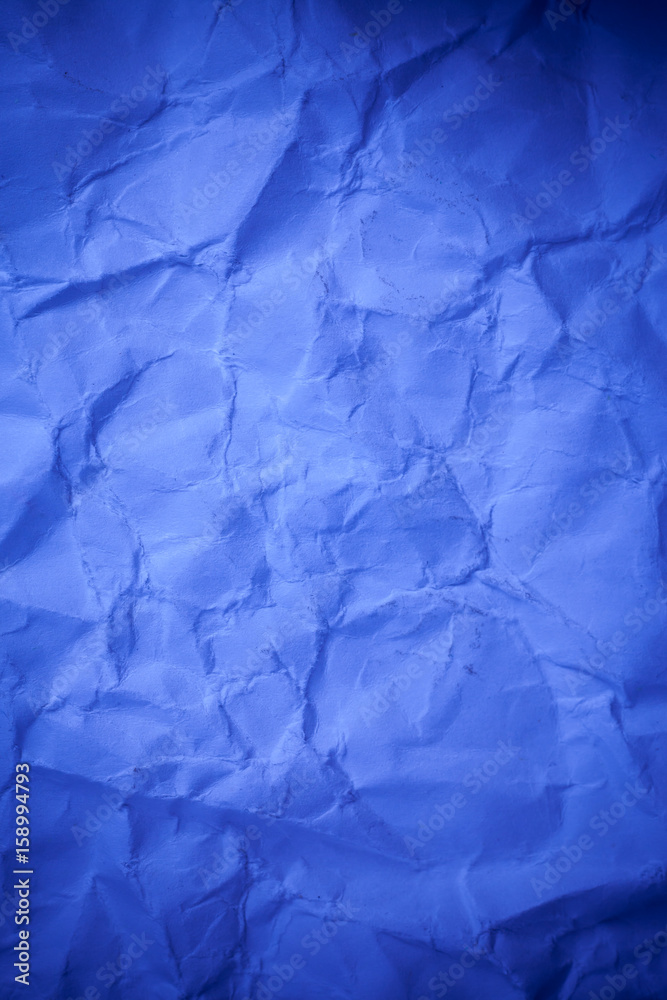Blue crumpled paper texture background.