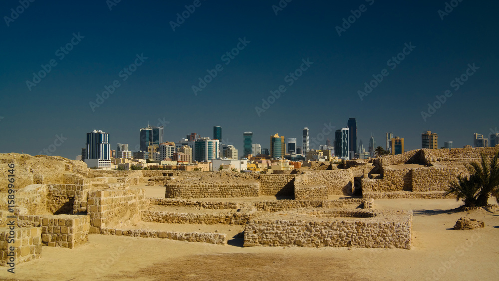 Ruins of Qalat fort and Manama in Bahrain