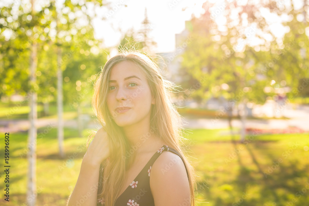 Beautiful young woman in the park. Outdoor portrait Beautiful young woman in the park. Outdoor portrait