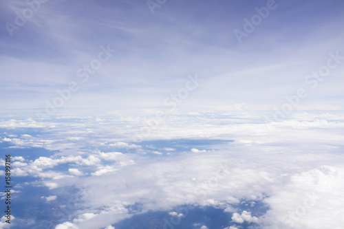 Cloudy sky from window airplane view. Nature and abstract background.