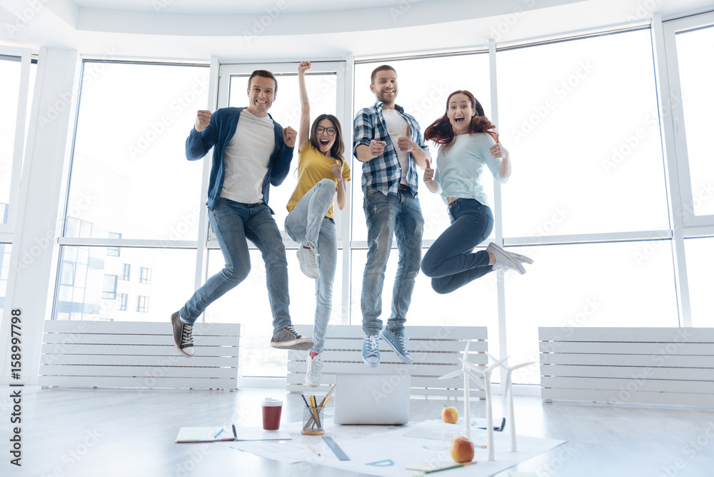 Fototapeta premium Happy nice people making a jump