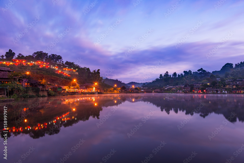 Beautiful lake and sky view of the Rak Thai village and mountain reflection in Pai district, Mae Hong Son Province, Thailand.