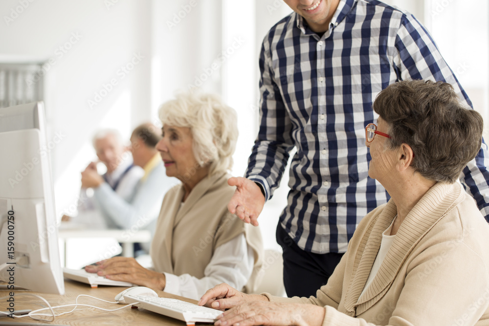 Fototapeta premium Senior lady talking to lecturer