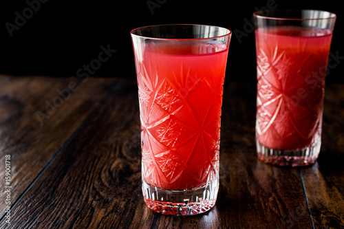Kizilcik serbeti / Cranberry Sherbet on dark wooden surface. photo
