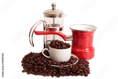 Coffee beans and a white cup on white background