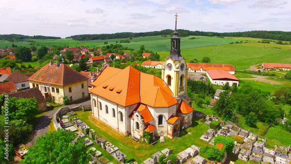 Church of St John the Baptist (1358) in small village Vreskovice. Architecture from above. Religious monument in Czech Republic, Central Europe. Church of St John the Baptist (1358) in small village Vreskovice. Architecture from above. Religious monument in Czech Republic, Central Europe.