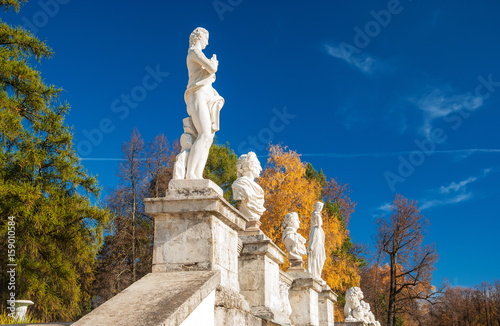 Ancient sculptures on the terrace of the autumn park