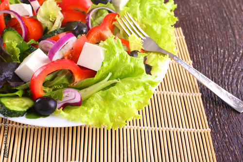 Fresh vegetables on wooden and blur background photo