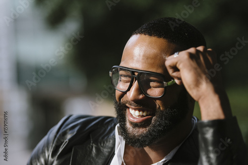 Smiling happy bearded black man outdoors