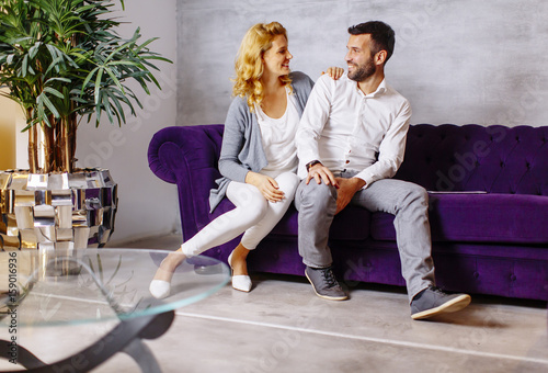Couple sitting in a comfort...
