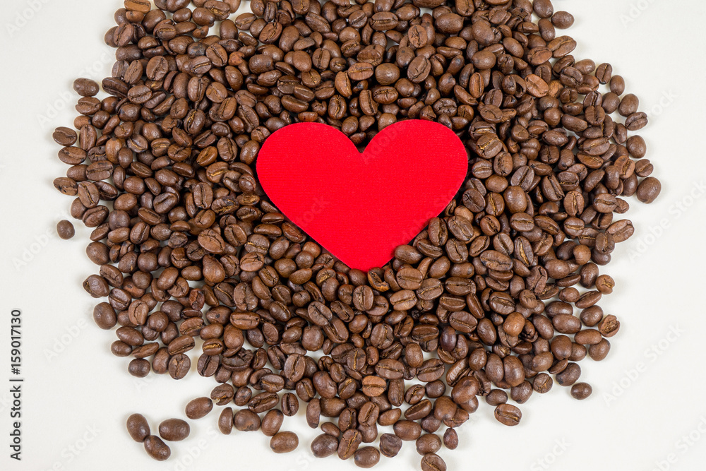red heart on coffee beans background red heart on coffee beans background