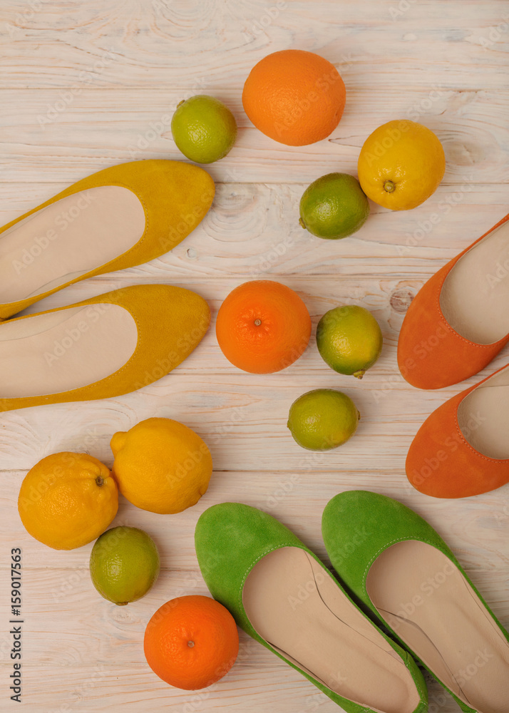 Summer conceptual photoset - women's shoes of yellow, orange and green colors and citrus - lemons, oranges and limes. Summer conceptual photoset - women's shoes of yellow, orange and green colors and citrus - lemons, oranges and limes.