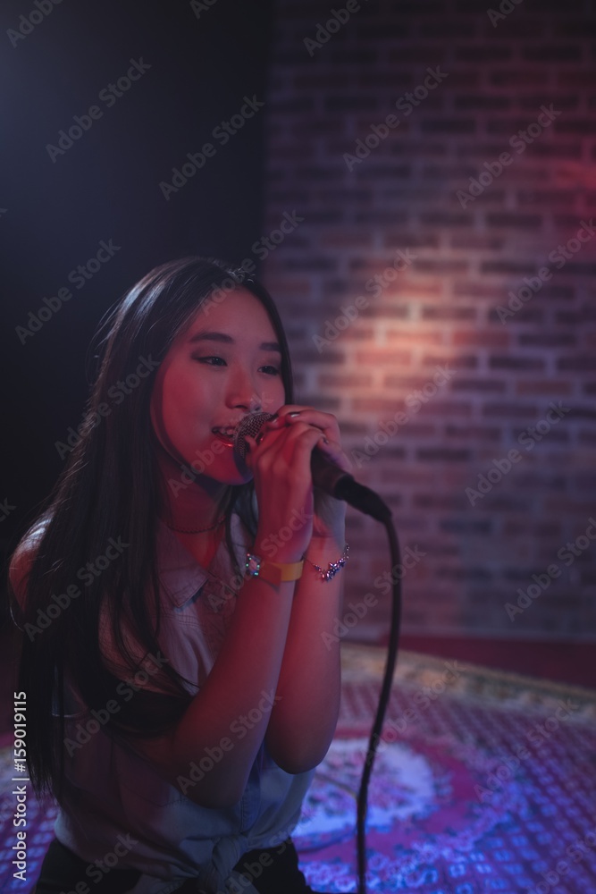 Beautiful female singer performing at music concert Beautiful female singer performing at music concert