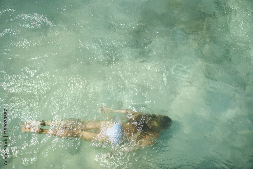Beautiful woman floating in the ocean Beautiful woman floating in the ocean