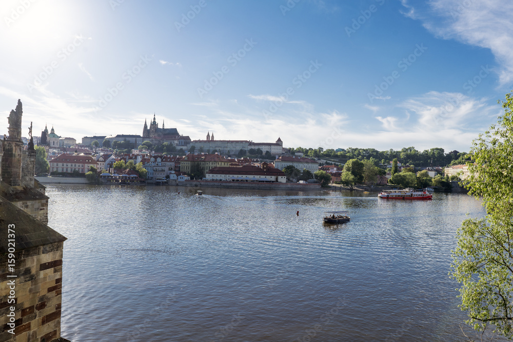 View of the Vltava river with the cathedral and the castle in the background, Prague.