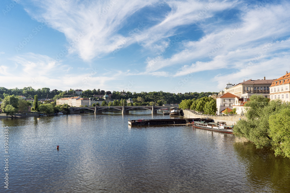 View of the Vltava river with the Manesuv bridge in the background from the Charles Bridge, Prague.