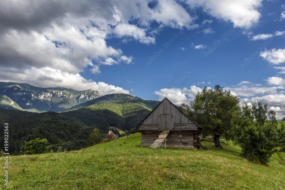 Stunning rural farm with old wooden hut in Bran, Transylvania, Romania
