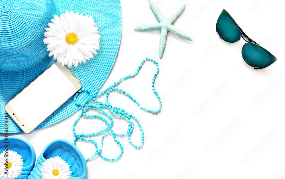 Tablet with blank screen on white surface with beach items, top view Tablet with blank screen on white surface with beach items, top view