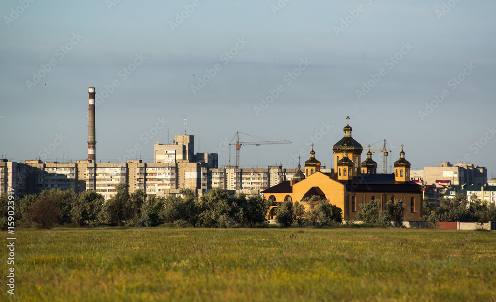 Houses and cathedral on the outskirts of the city