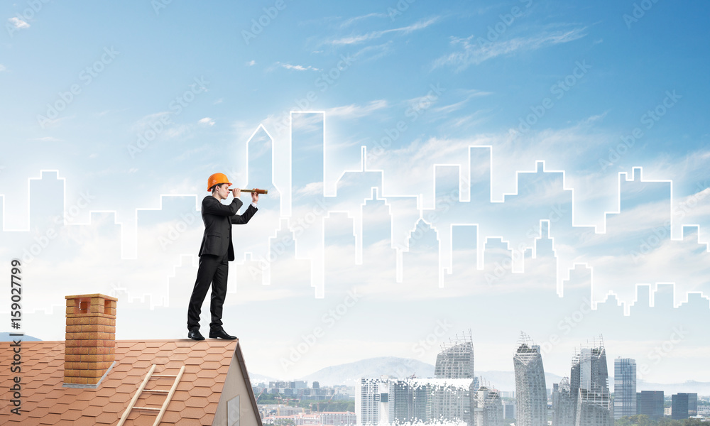Engineer man standing on roof and looking in spyglass. Mixed media Engineer man standing on roof and looking in spyglass. Mixed media