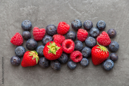 fresh fruits on dark slate