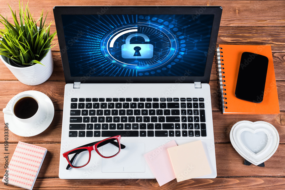 Web security and technology concept with laptop on wooden table