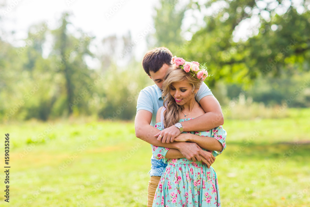 Young couple in love hug each other in nature Young couple in love hug each other in nature