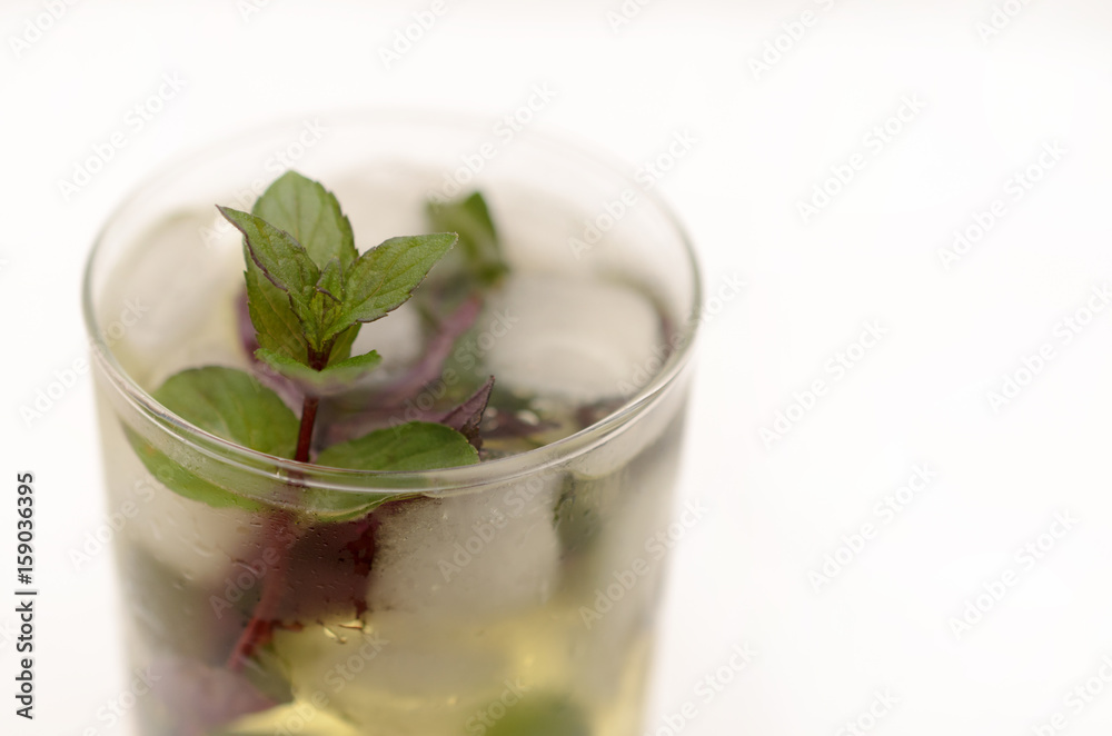 Kentucky derby drink in a glass goblet on a light background. Kentucky derby drink in a glass goblet on a light background.