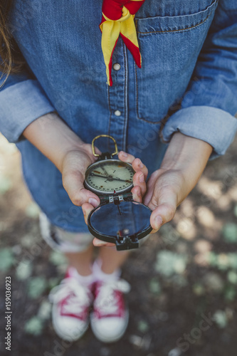 A Girl Scout Holding A Compass photo