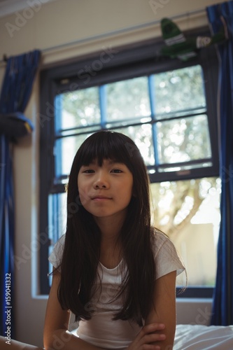 Free Download Smiling girl sitting on bed in the bed room - GFXLoad