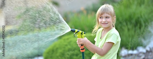cute little girl watering