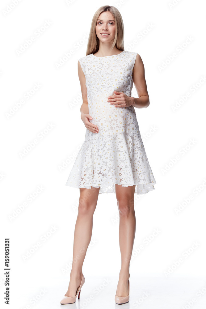 Beautiful elegant pregnant woman blond hair wear style fashion dress for mother hold in hand tummy wait for baby child new born pretty lady clothes for pregnancy white background collection heath. Beautiful elegant pregnant woman blond hair wear style fashion dress for mother hold in hand tummy wait for baby child new born pretty lady clothes for pregnancy white background collection heath.