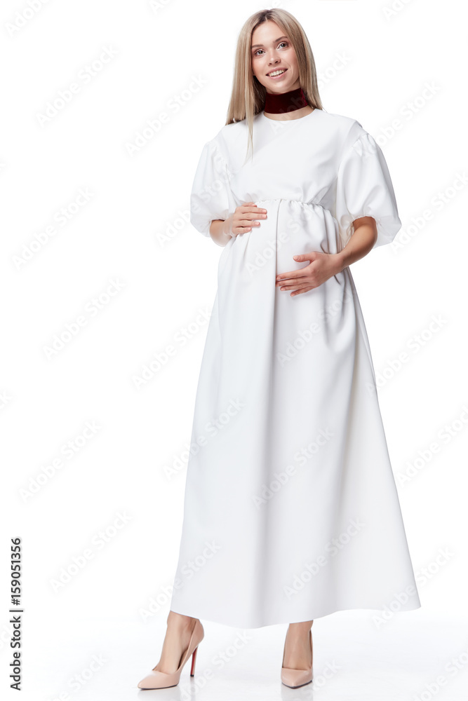 Beautiful elegant pregnant woman blond hair wear style fashion dress for mother hold in hand tummy wait for baby child new born pretty lady clothes for pregnancy white background collection heath. Beautiful elegant pregnant woman blond hair wear style fashion dress for mother hold in hand tummy wait for baby child new born pretty lady clothes for pregnancy white background collection heath.