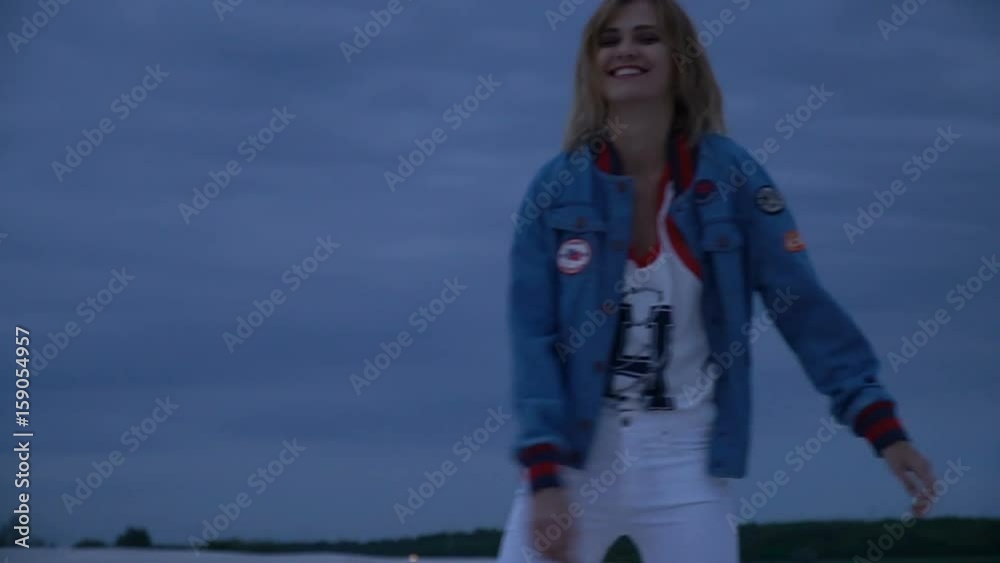 Young girl having fun on beach in the evening Young girl having fun on beach in the evening
