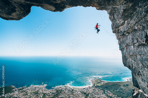 Rock climber taking a fall on Table Mountain, Cape Town