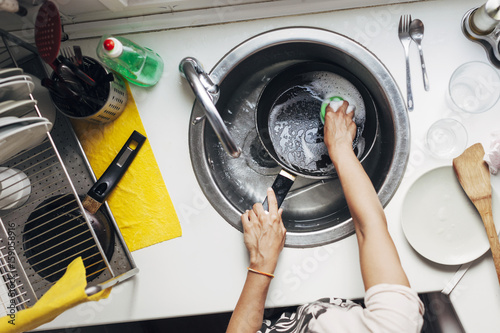 Woman washing dishes