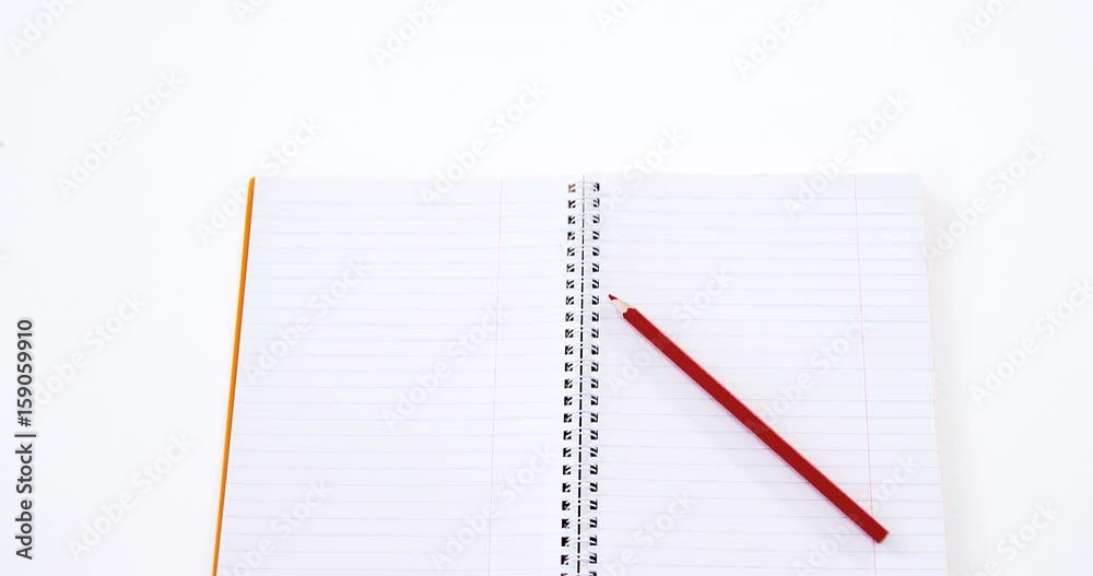 Red color pencil kept on the book Red color pencil kept on the book