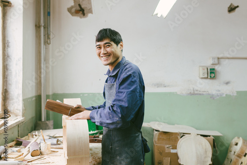 Violoncello maker at work photo