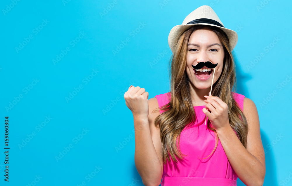 Fototapeta premium Young woman holding paper party sticks