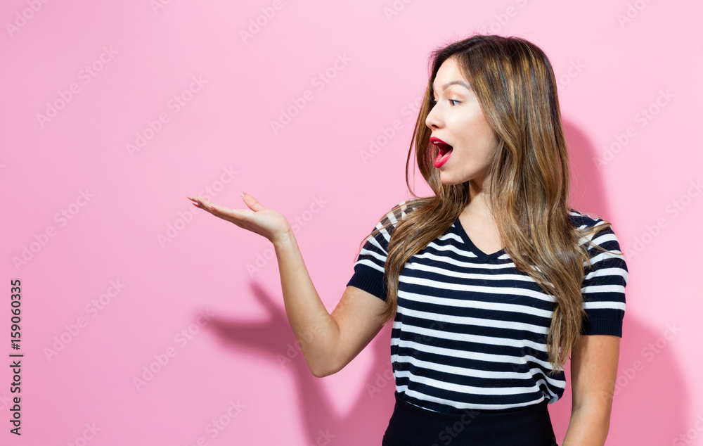 Young woman with displaying hand gesture Young woman with displaying hand gesture