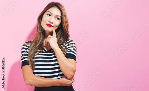 Young woman in a thoughtful pose