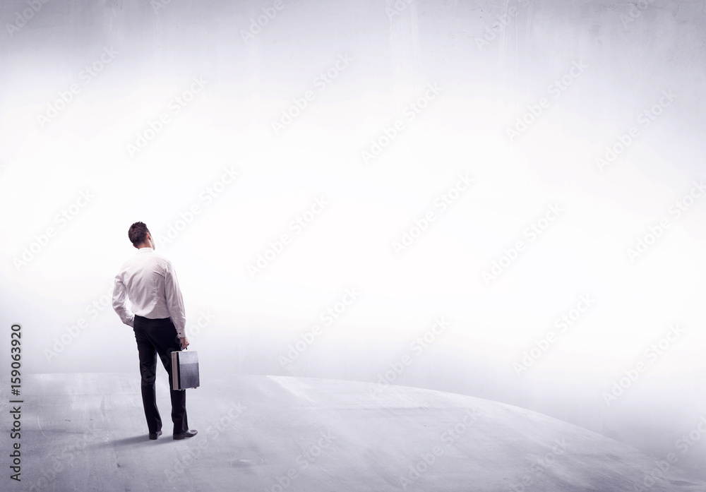 Business person standing from rear view Business person standing from rear view