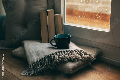 Coffee time in a cozy home on a rainy day photo